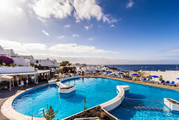Outdoor pool, pool umbrellas, pool loungers