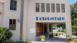 A building with a sign reading "Hotel el Faro". - Parador El Faro (Aguadilla)
