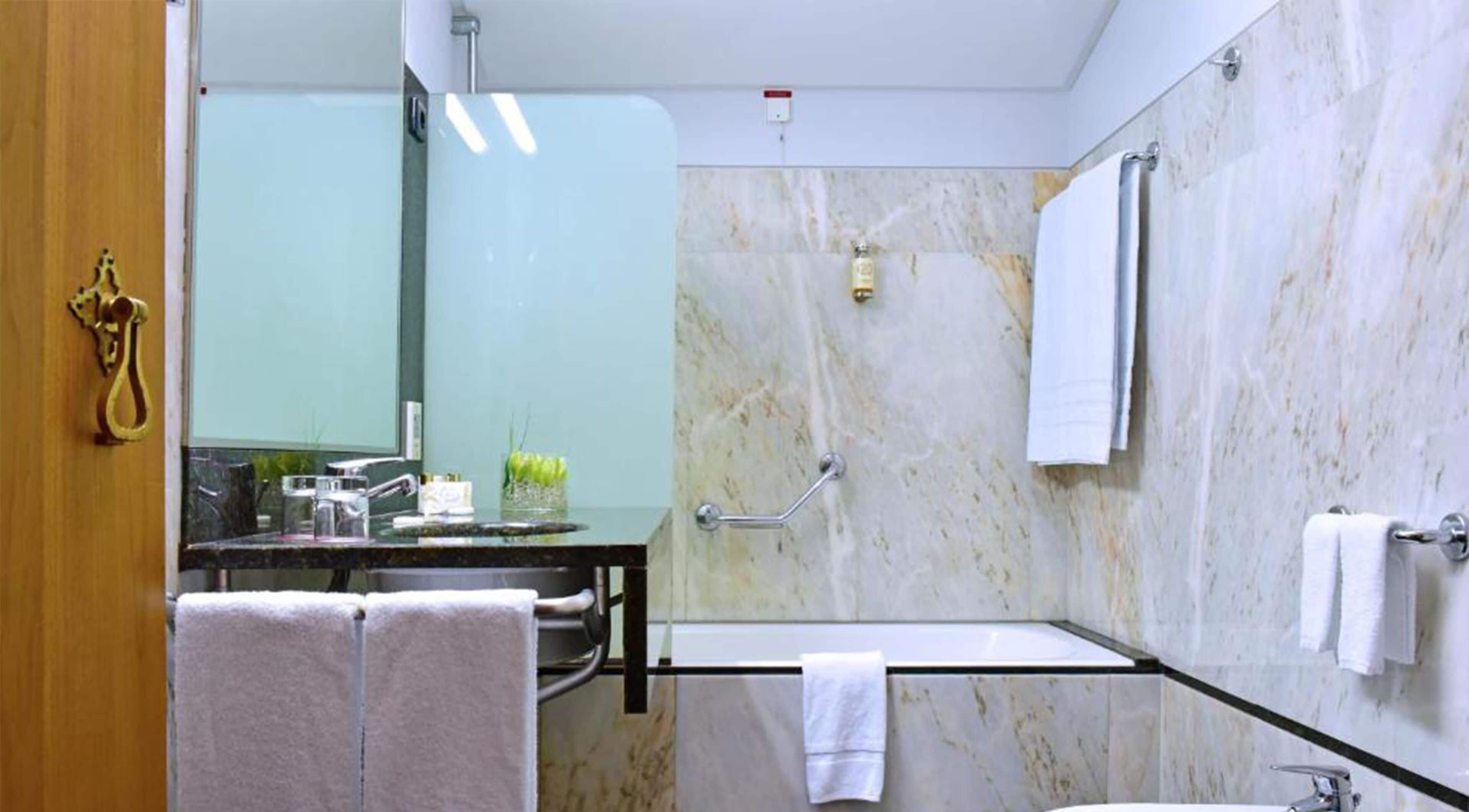 combined shower/bathtub, free toiletries, hair dryer, bathrobes