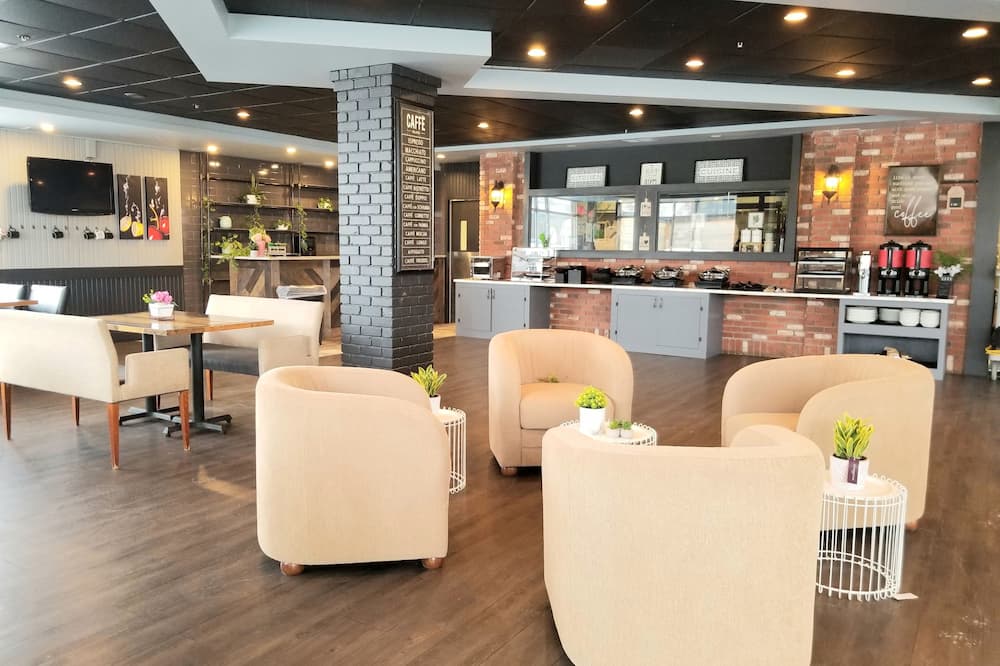 Merit Hotel & Suites