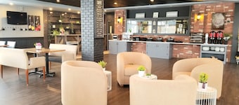 Merit Hotel & Suites