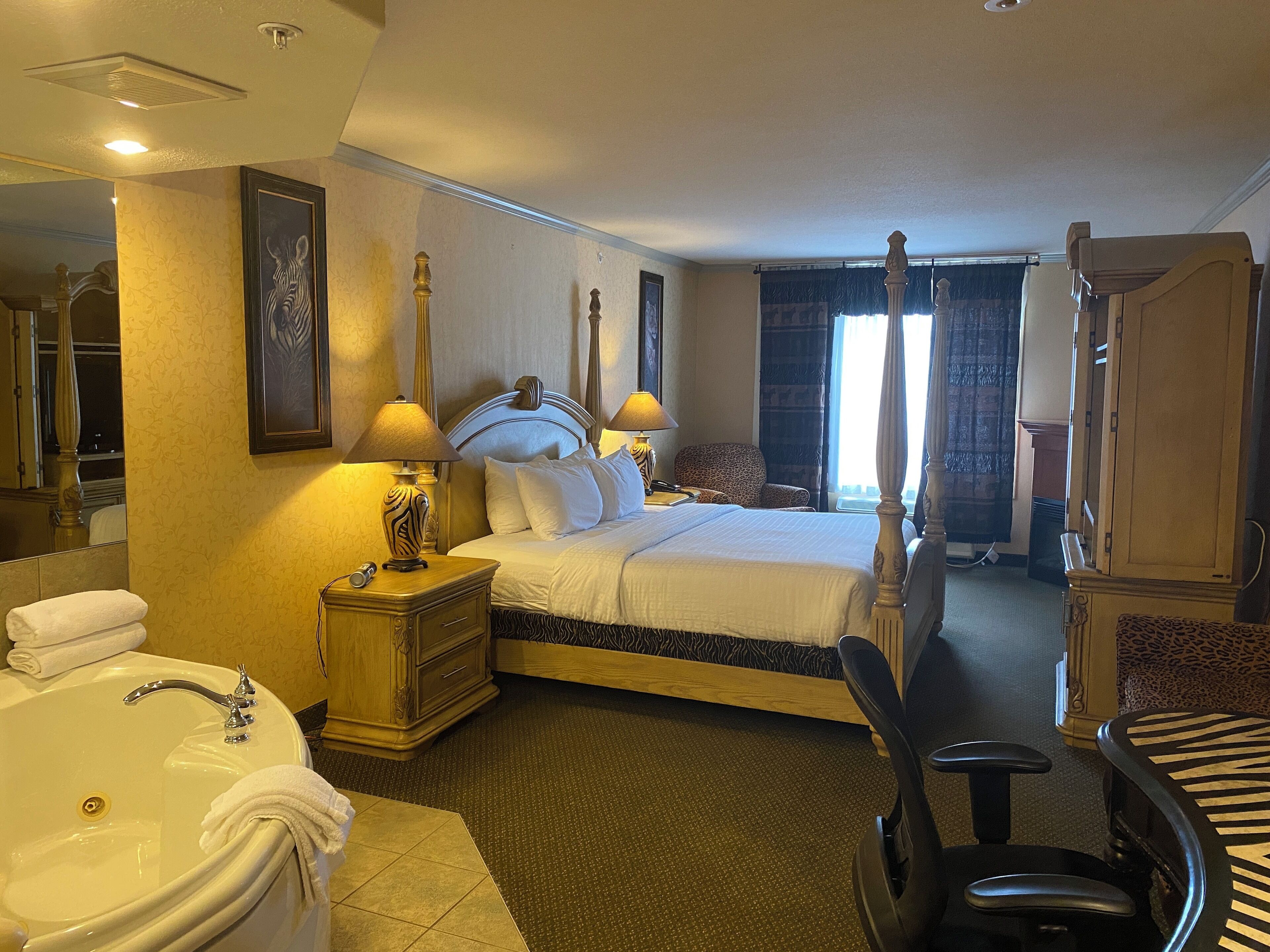Premium bedding, desk, laptop workspace, iron/ironing board