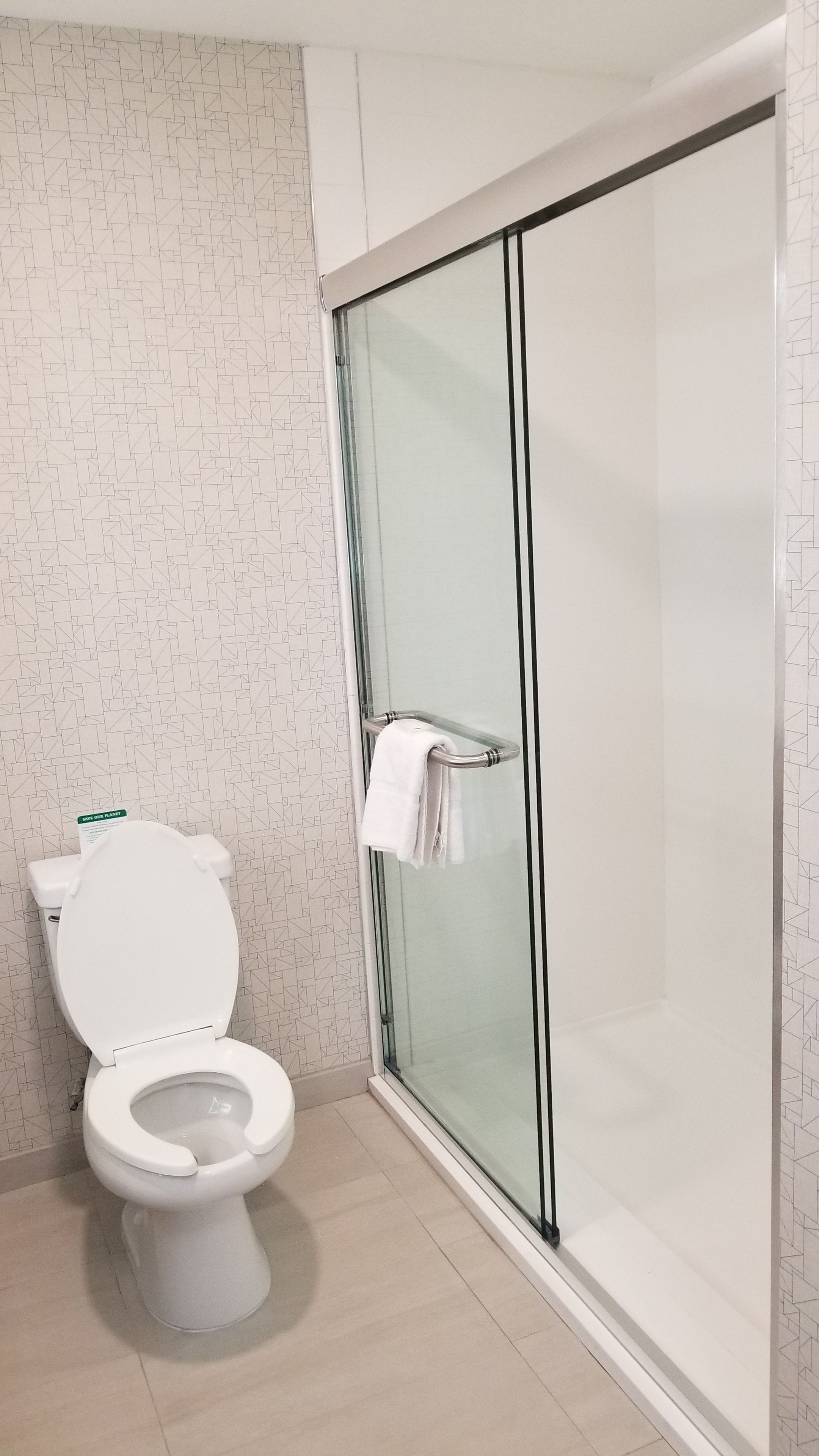 combined shower/bathtub, free toiletries, hair dryer, towels