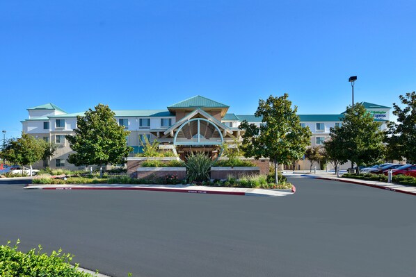 A hotel with a distinctive architectural design, featuring a central atrium and multiple levels.