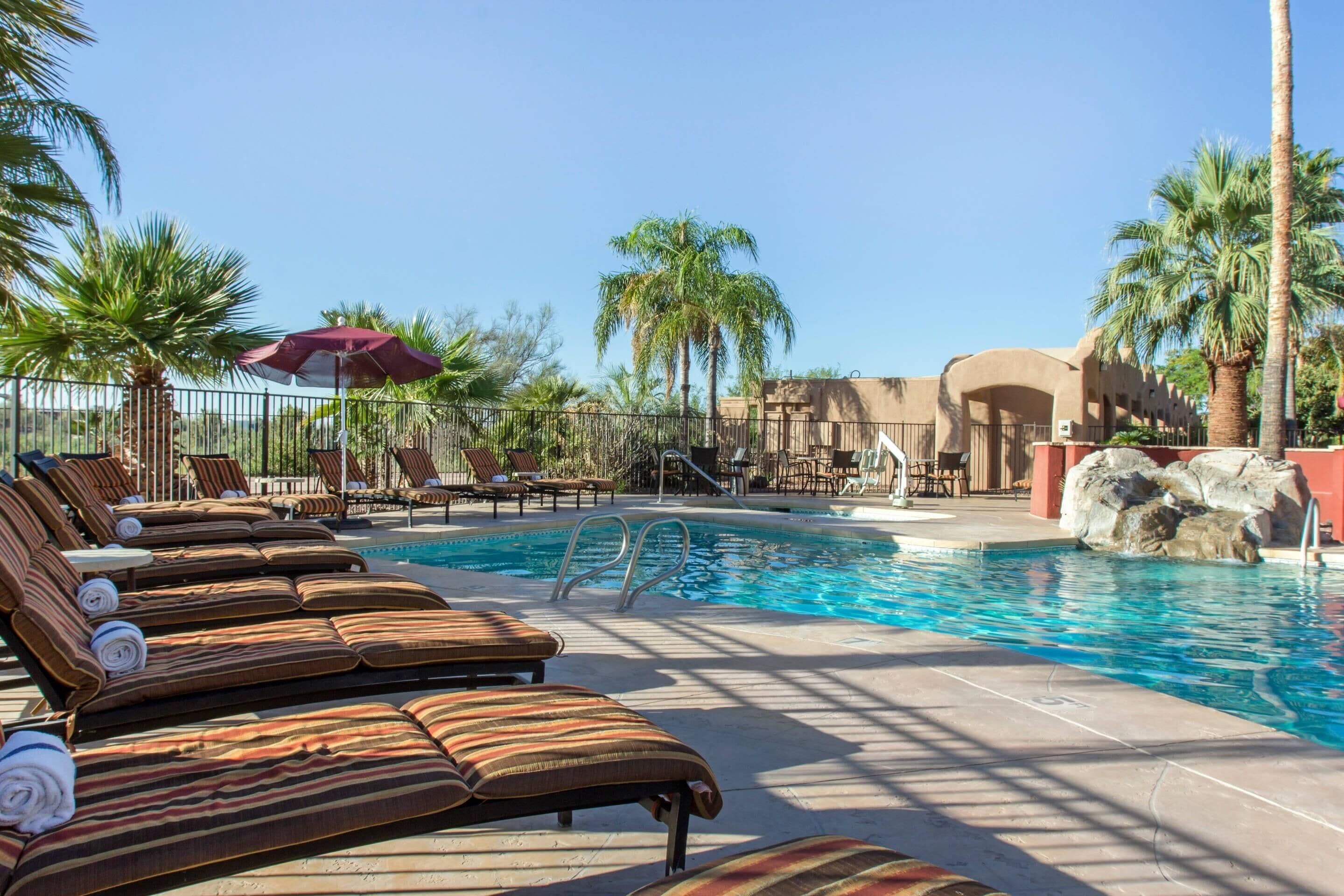 Outdoor pool, pool umbrellas, sun loungers