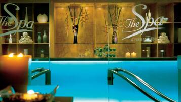 Relax in The Spa, featuring a reception area with a glass partition and a selection of spa amenities.