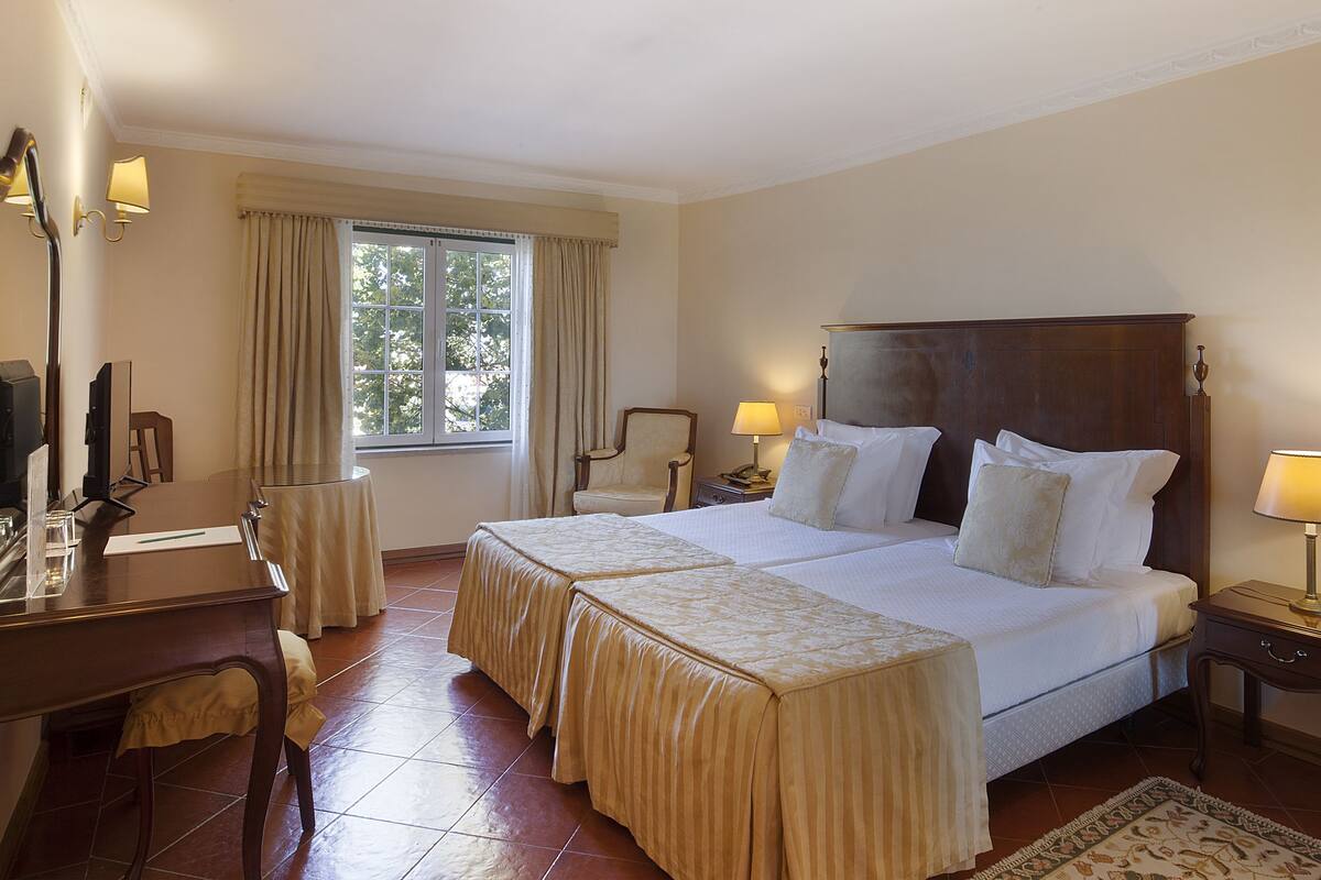 Superior Twin Room | Minibar, in-room safe, desk, blackout drapes