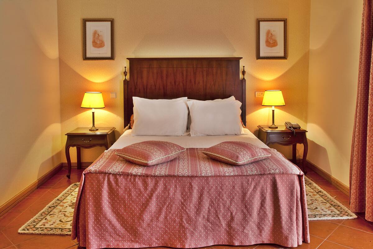 Standard Double Room | Minibar, in-room safe, desk, blackout drapes