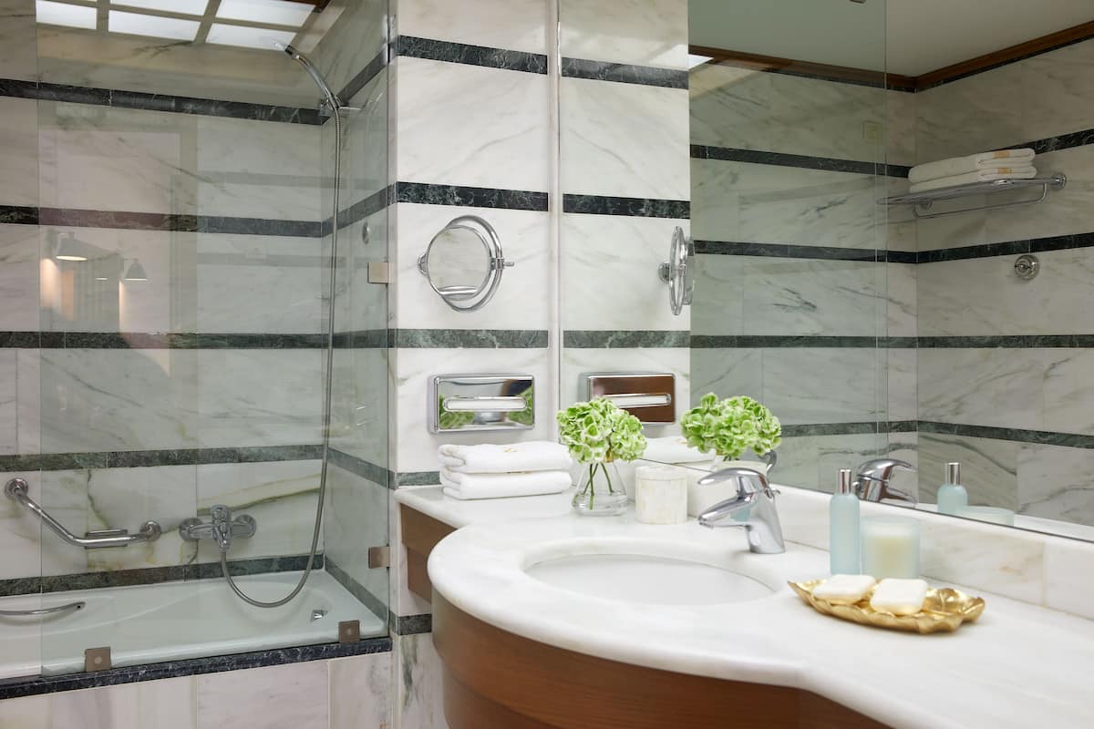 bungalow suite private pool | bathroom | shower, designer toiletries, hair dryer, bathrobes