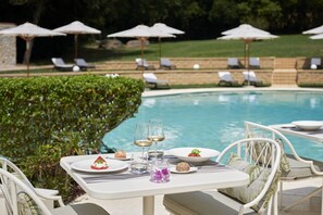 Indoor pool, seasonal outdoor pool, pool umbrellas, pool loungers