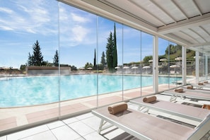 Indoor pool, seasonal outdoor pool, pool umbrellas, pool loungers