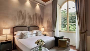 Hypo-allergenic bedding, down comforters, minibar, in-room safe