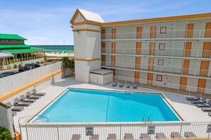 Outdoor pool, open 9 AM to 10 PM, pool umbrellas, sun loungers