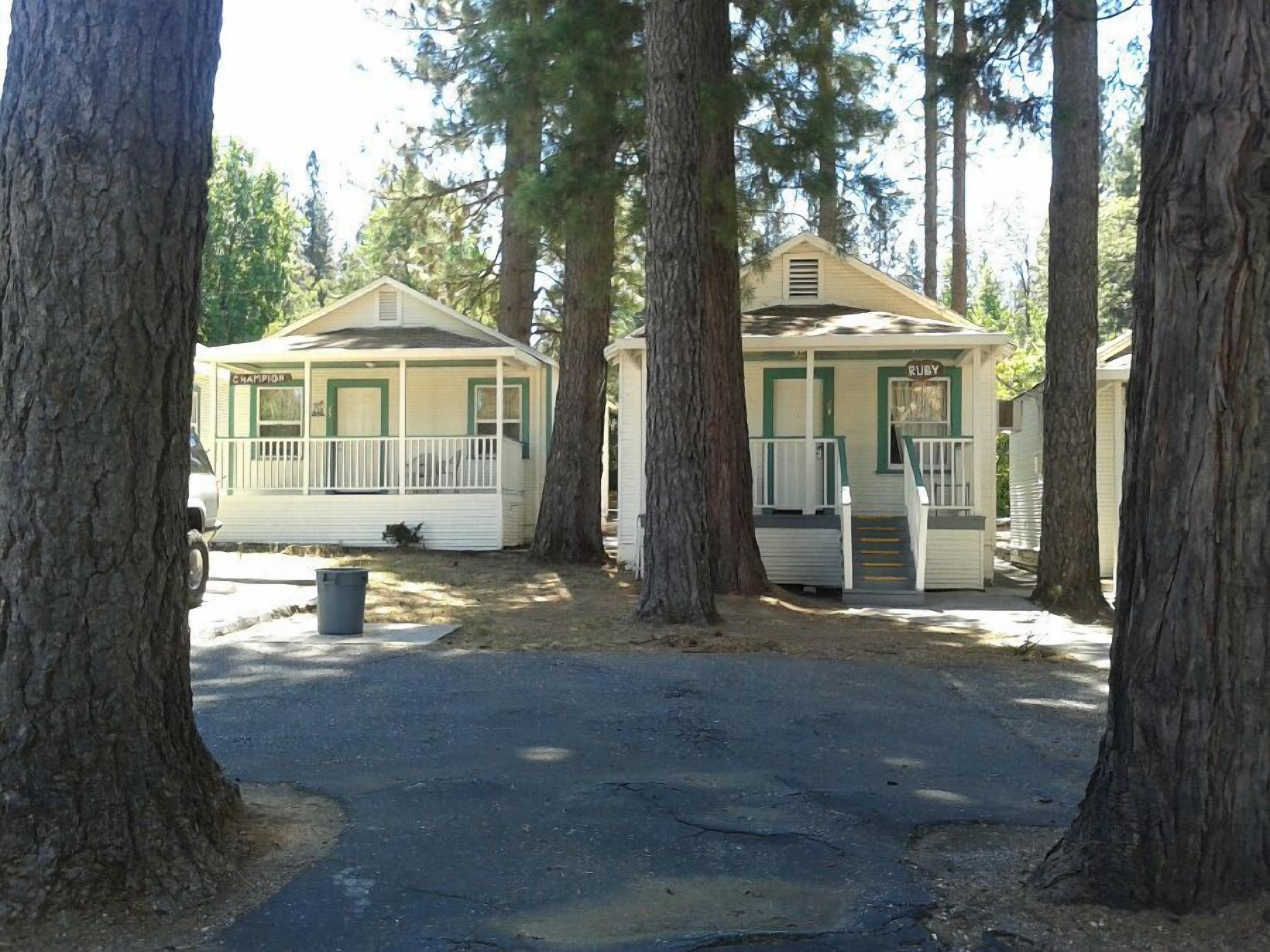 A row of cabins with a porch and a small building labeled "RUBY" in the center.