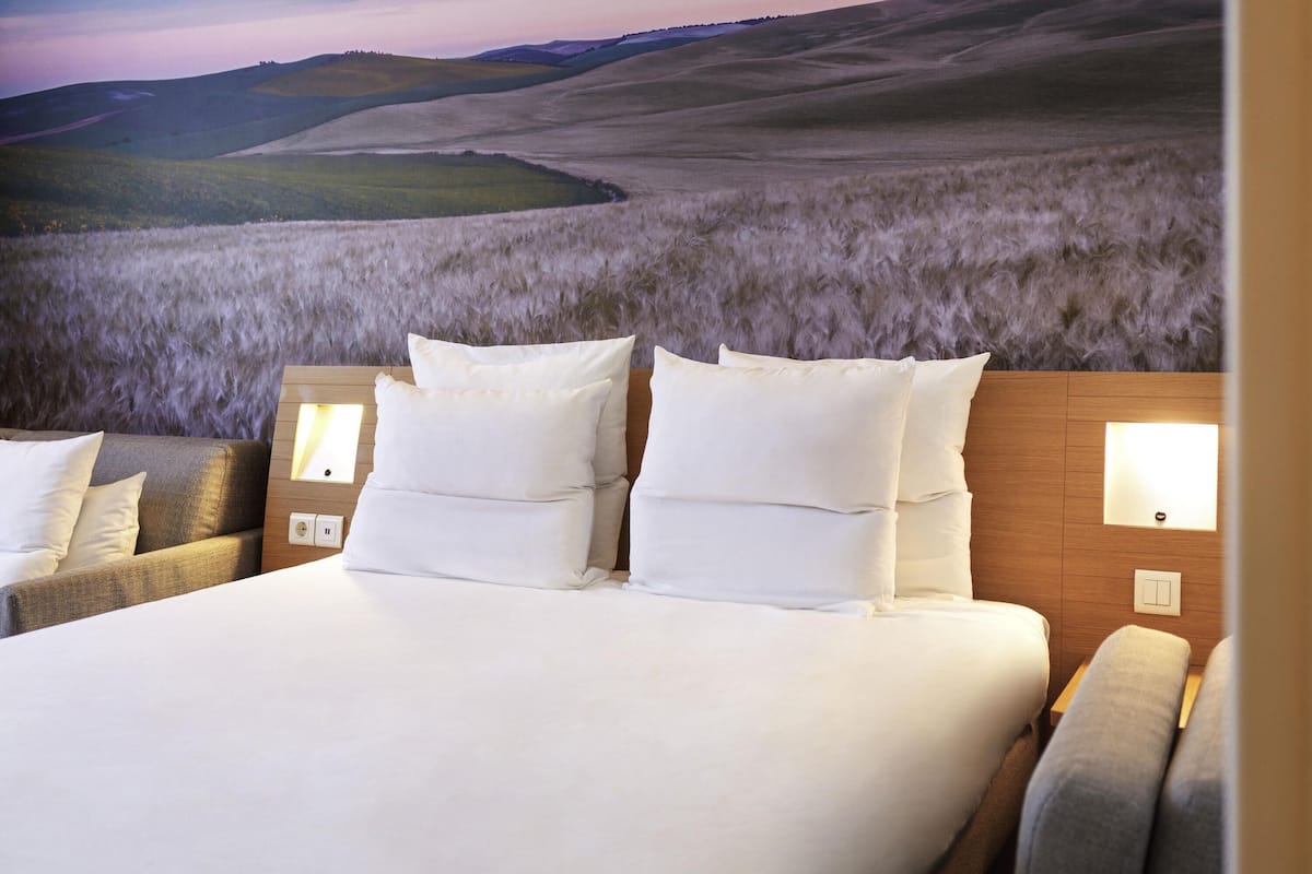 superior room, 1 queen bed with sofa bed | hypo-allergenic bedding, down duvets, memory-foam beds, in-room safe
