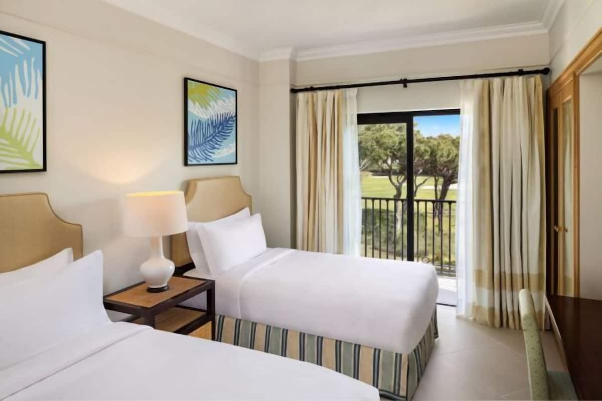 Premium bedding, pillow-top beds, in-room safe, desk