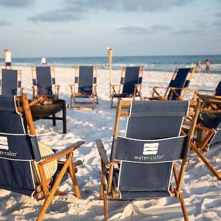 On the beach, white sand, sun loungers, beach umbrellas