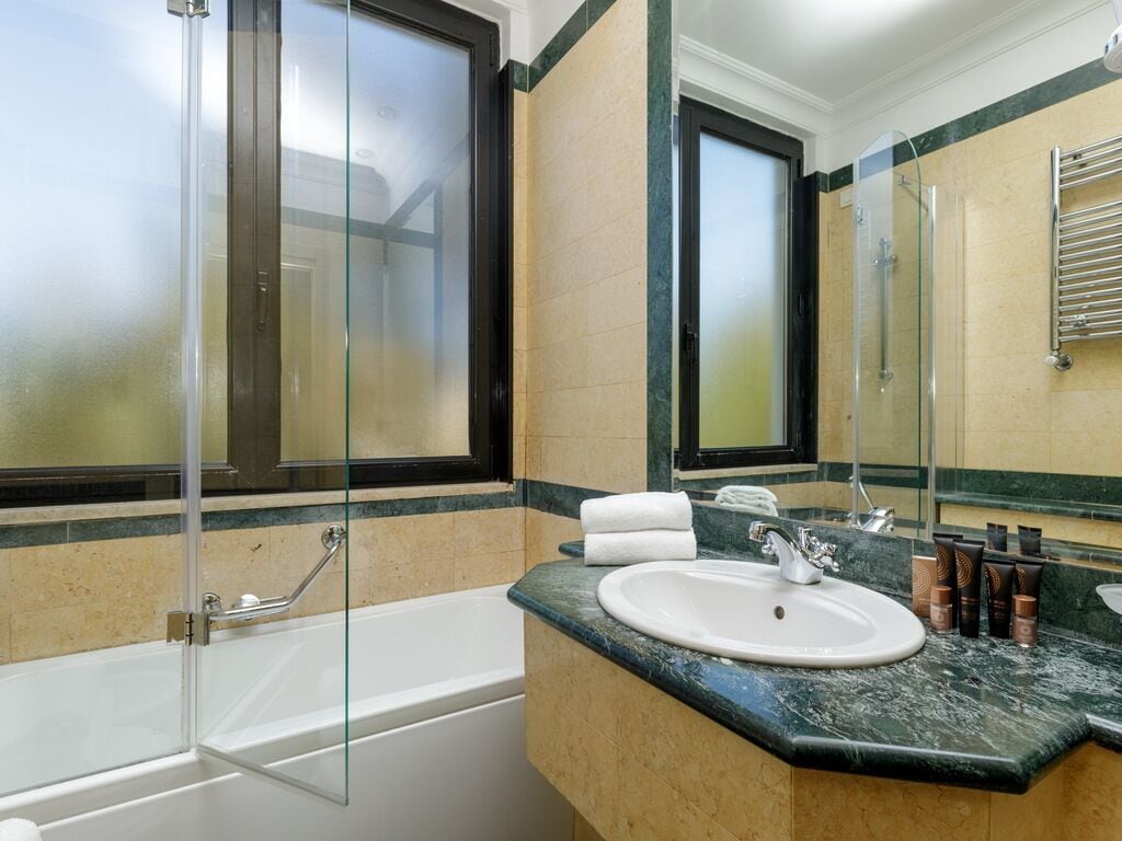 classic room | bathroom | rainfall showerhead, free toiletries, hair dryer, bidet