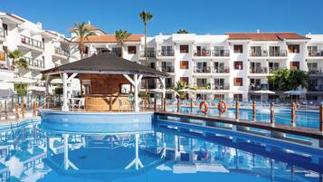 Relax by the pool surrounded by lounge chairs on a well-maintained deck.