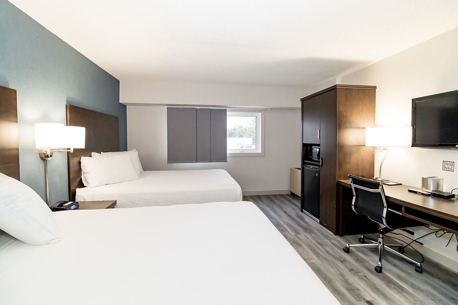 premier room, 2 queen beds | 1 bedroom, desk, iron/ironing board, free cots/infant beds