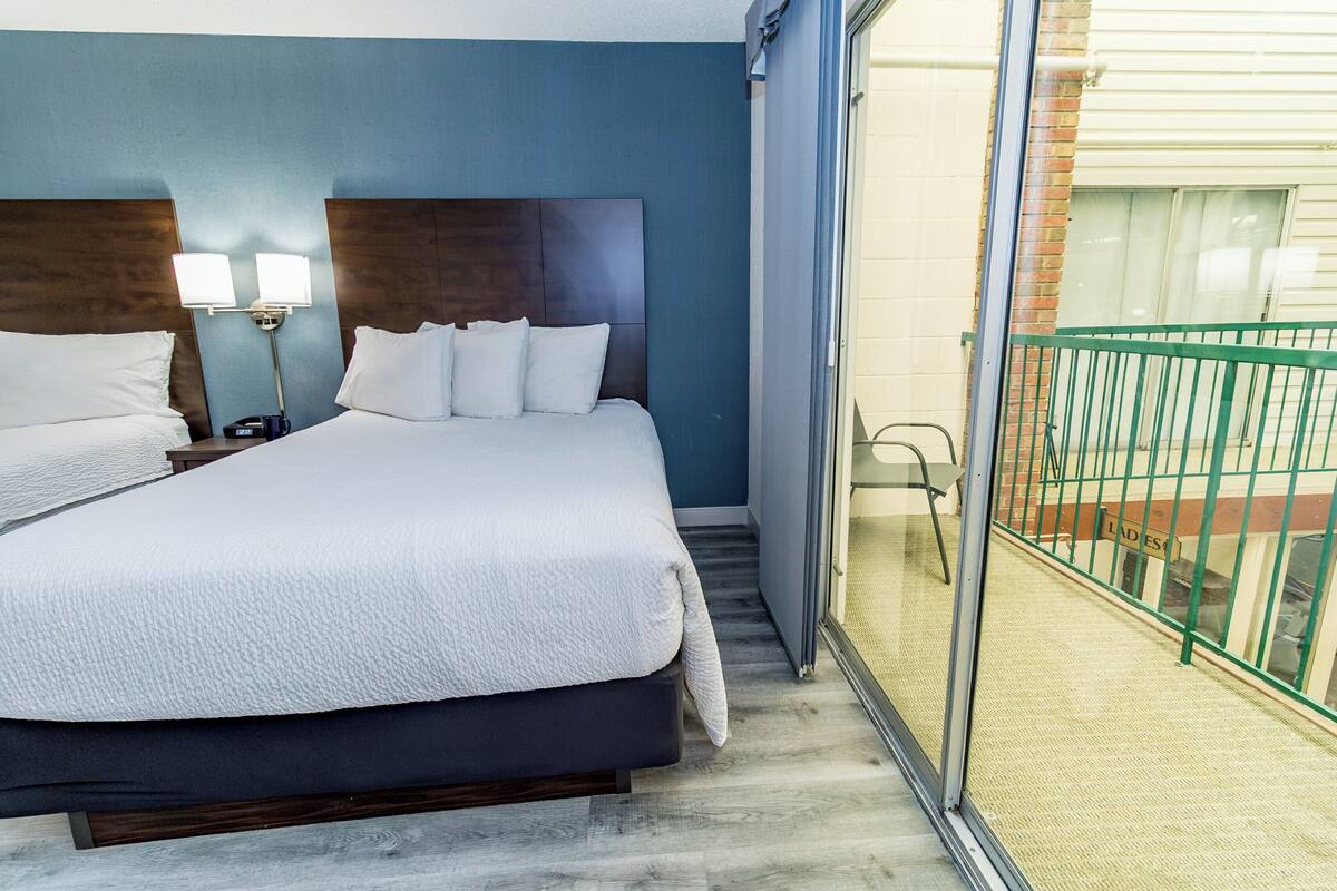 premier room, 2 queen beds, balcony | 1 bedroom, desk, iron/ironing board, free cots/infant beds