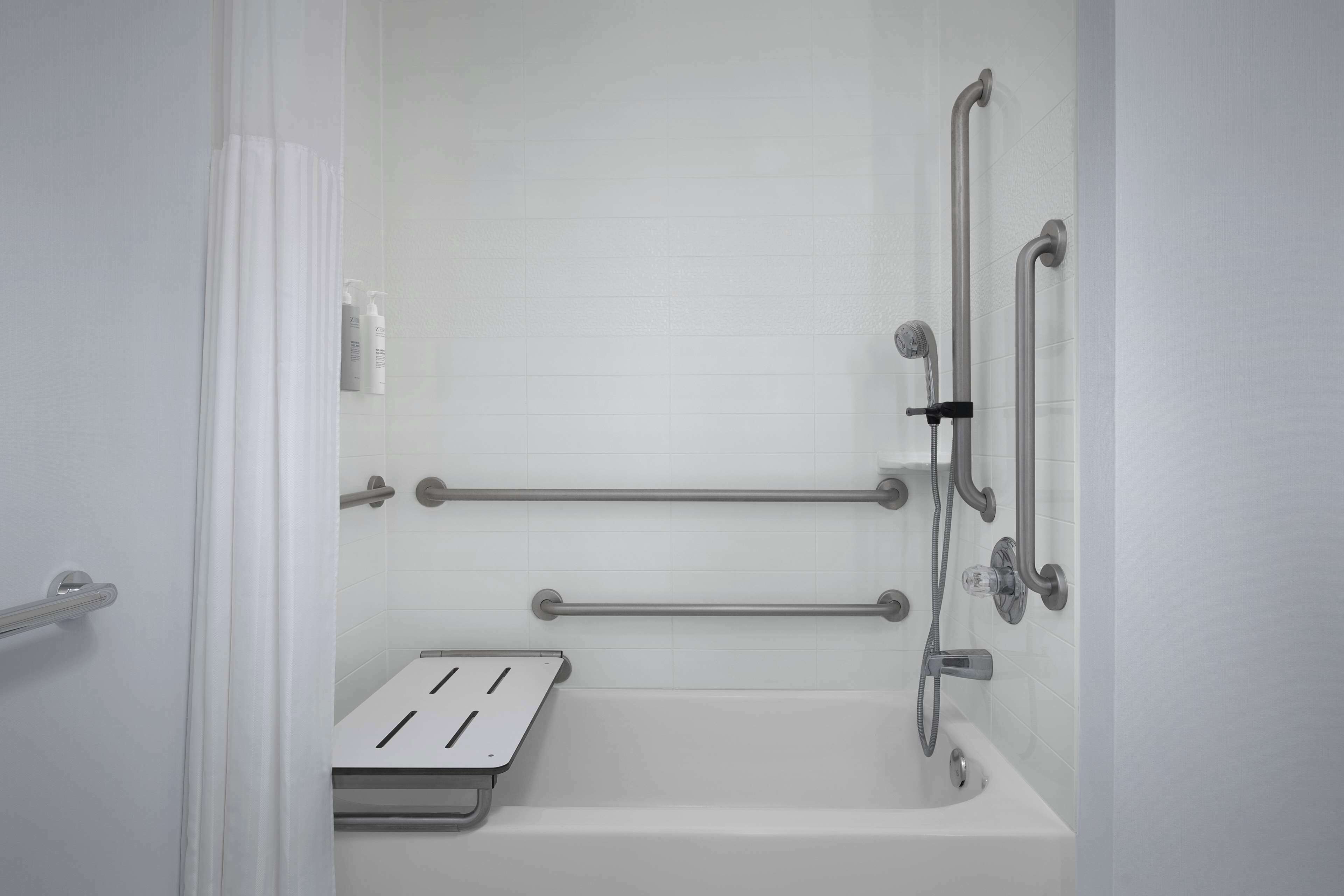 designer toiletries, hair dryer, towels, soap