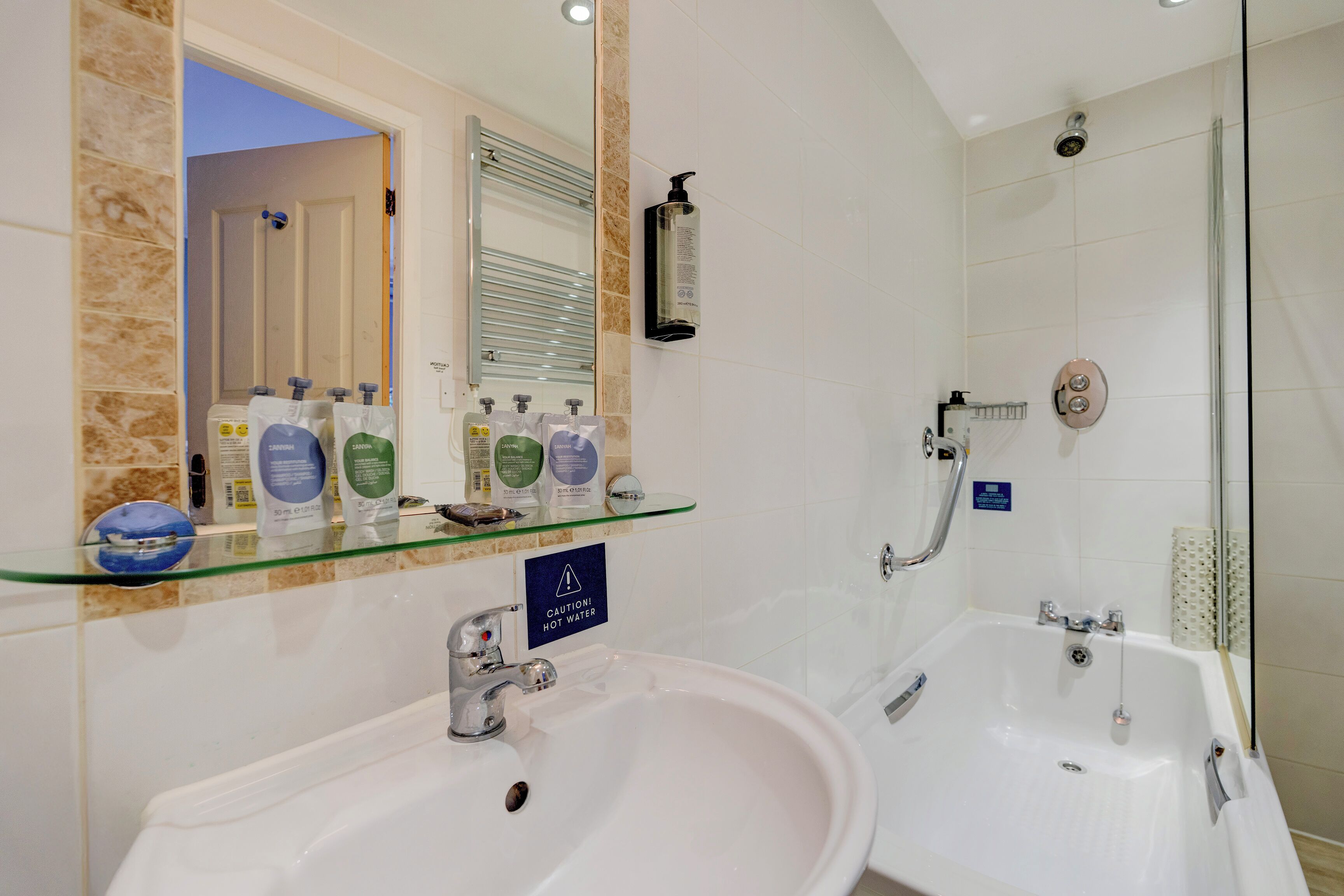 standard quad room | bathroom | combined shower/bathtub, free toiletries, hair dryer, towels