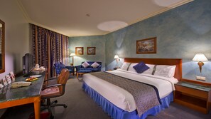 Suite, 1 Bedroom, Smoking (1 King Bed) | Minibar, in-room safe, iron/ironing board, free cribs/infant beds