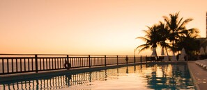 Outdoor pool, open 8:00 AM to 6:00 PM, pool umbrellas, sun loungers
