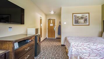 Desk, laptop workspace, blackout drapes, iron/ironing board