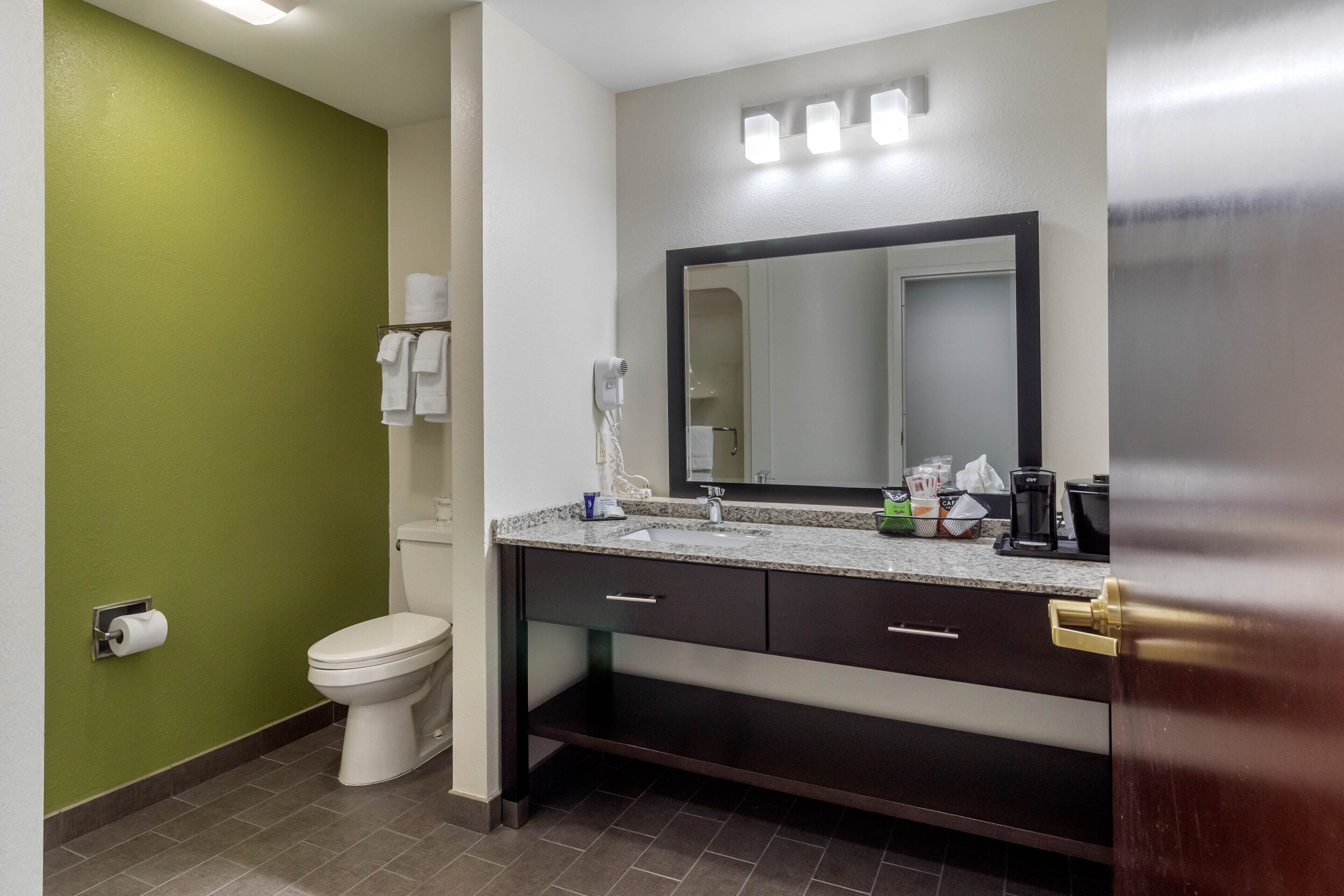 suite, 1 king bed, non smoking | bathroom | hair dryer, towels