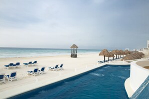 Outdoor pool, open 7:00 AM to 10:00 PM, pool umbrellas, pool loungers