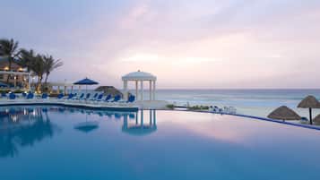 Outdoor pool, open 7:00 AM to 10:00 PM, pool umbrellas, pool loungers