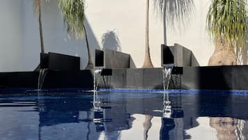 Outdoor pool, open 8:00 AM to 9:00 PM, pool loungers