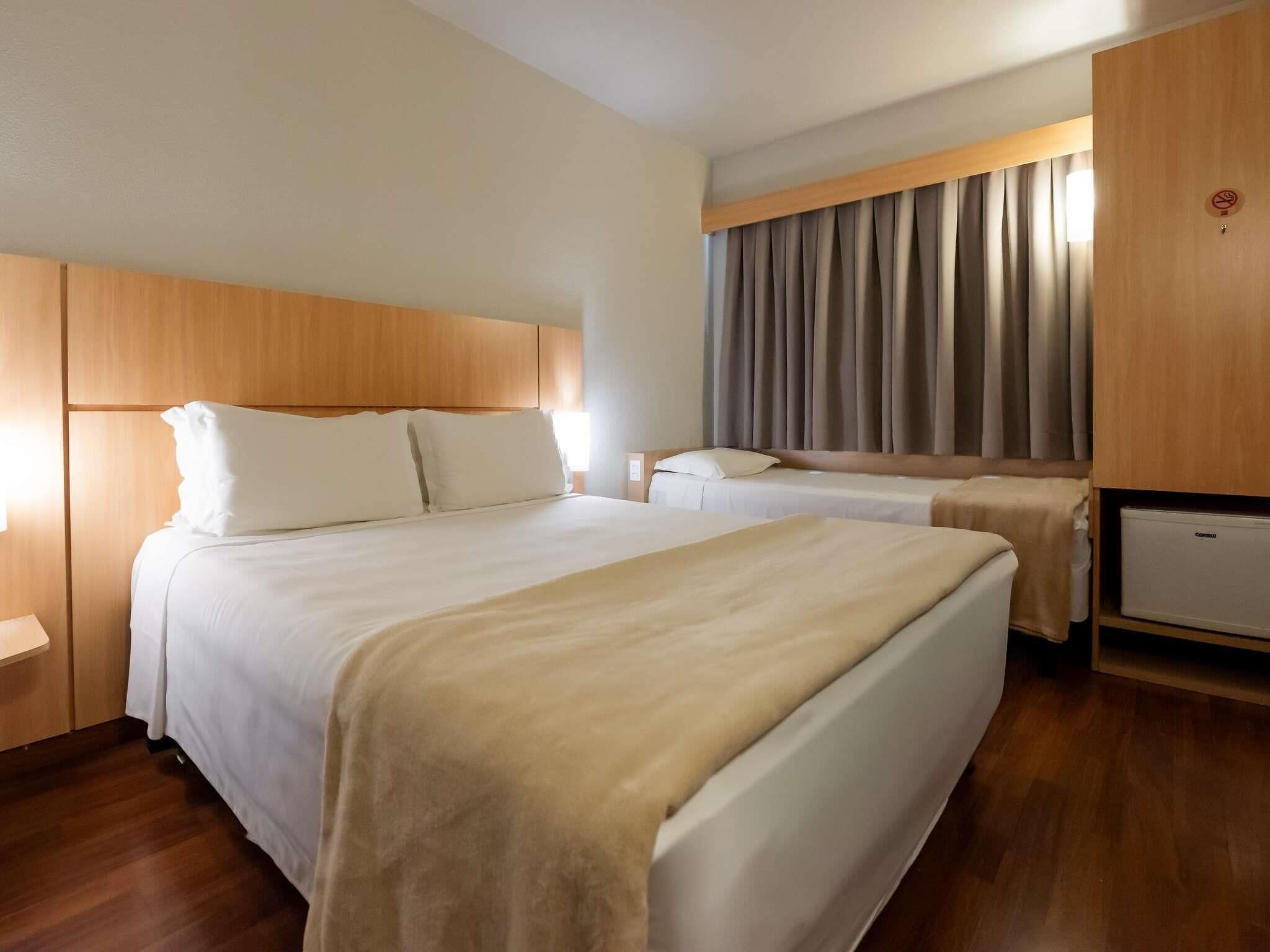 Standard Room, Multiple Beds | Minibar, in-room safe, desk, blackout drapes