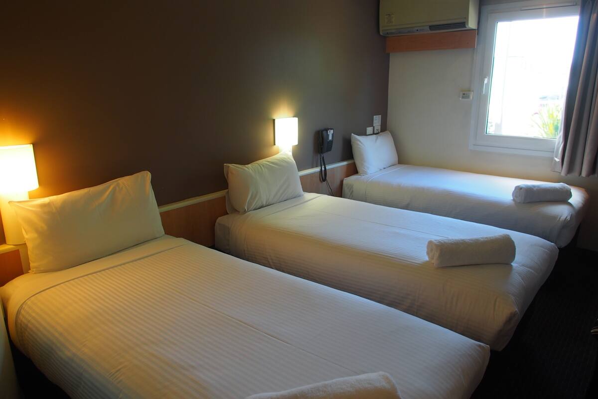 standard room, multiple beds | in-room safe, desk, soundproofing, iron/ironing board