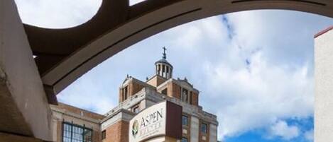 A building with a prominent sign reading "Aspen Hotels."