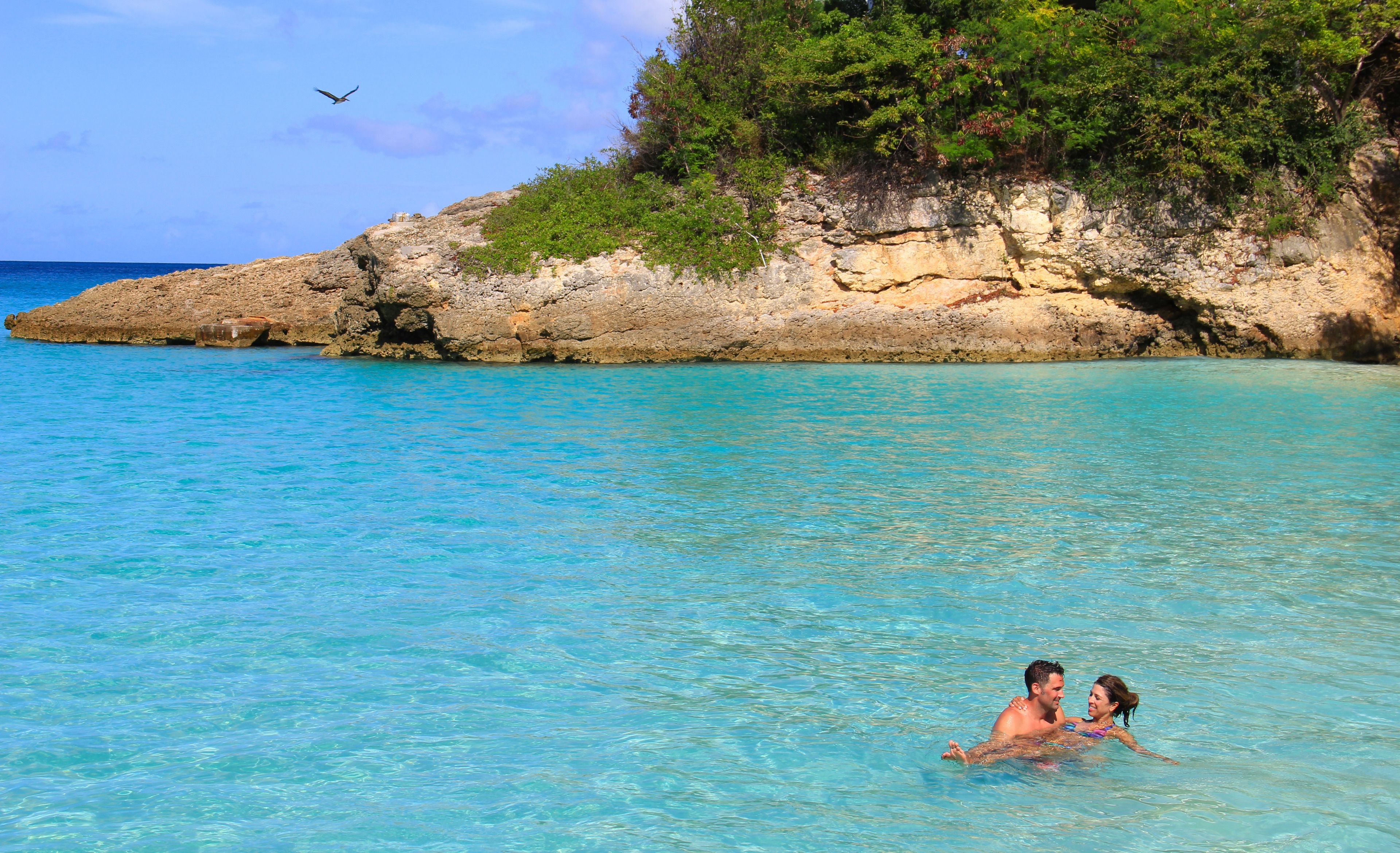 on the beach, white sand, sun-loungers, beach umbrellas