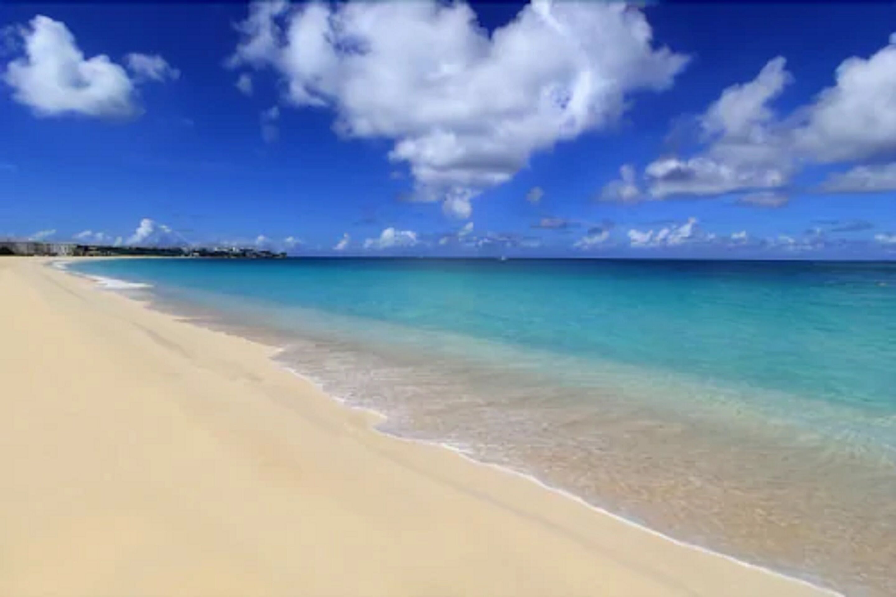 on the beach, white sand, sun-loungers, beach umbrellas