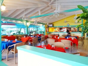 Breakfast, lunch, dinner served; international cuisine, beach views 