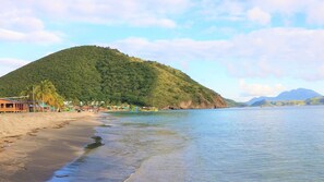 On the beach, sun loungers, beach towels, beach bar