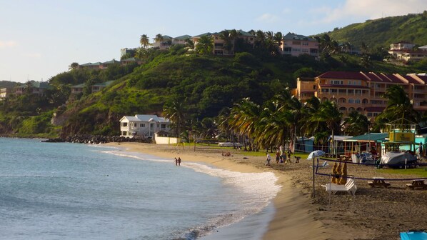 On the beach, sun-loungers, beach towels, beach bar