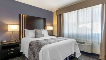 Premium bedding, pillow-top beds, desk, laptop workspace