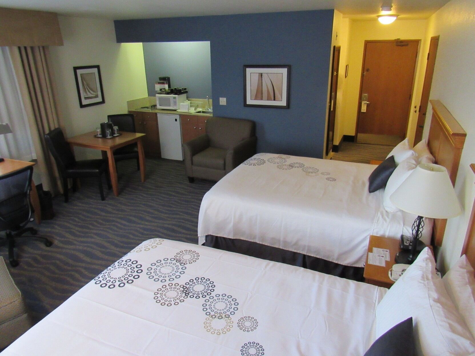 Premium bedding, pillowtop beds, desk, laptop workspace