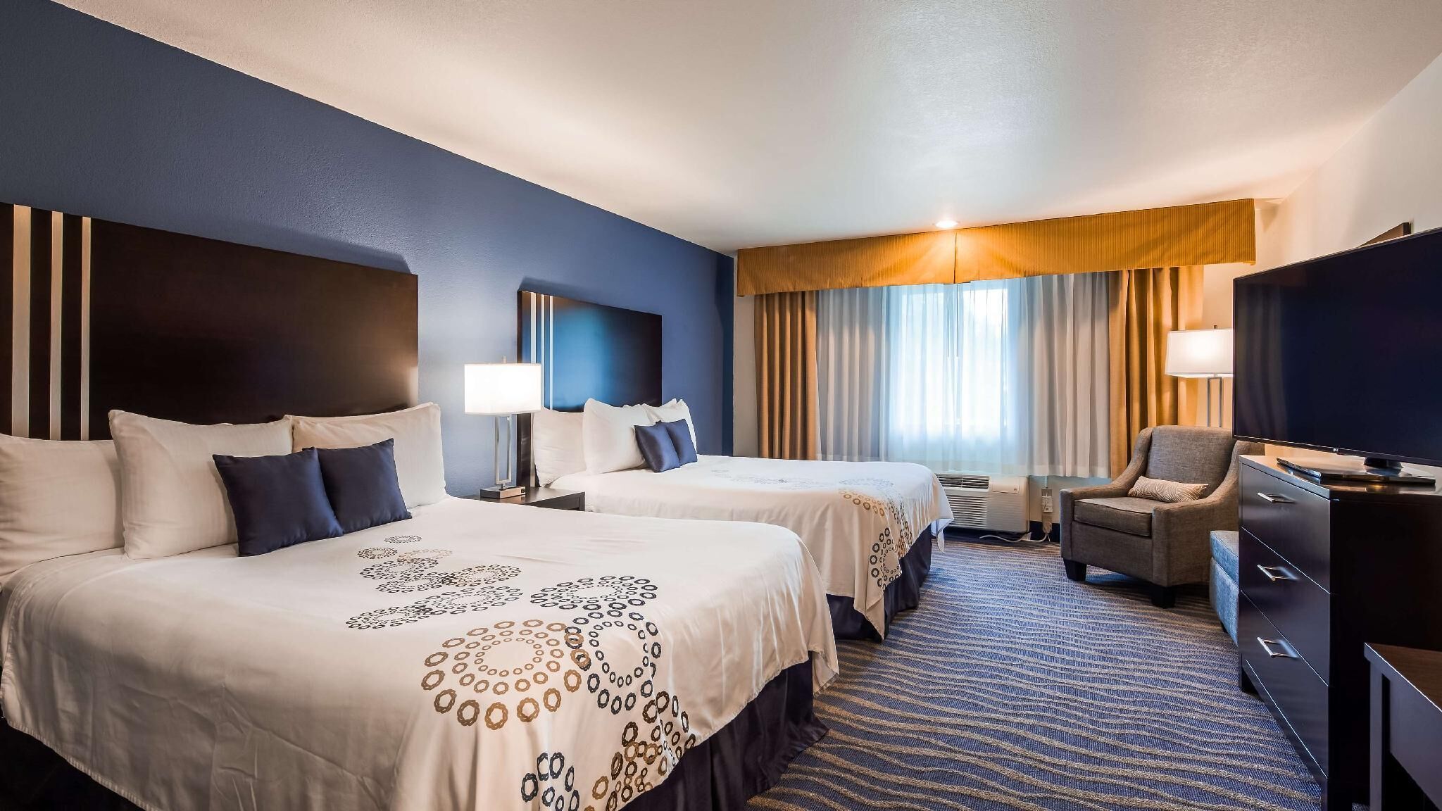 Premium bedding, pillowtop beds, desk, laptop workspace