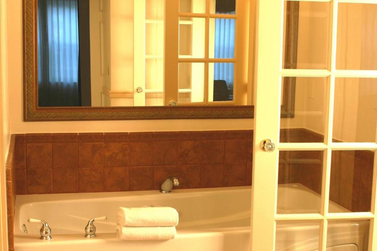 designer toiletries, hair dryer, bathrobes, towels