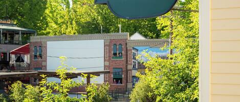A sign for Fairhaven Village Inn with a view of the surrounding buildings and trees.