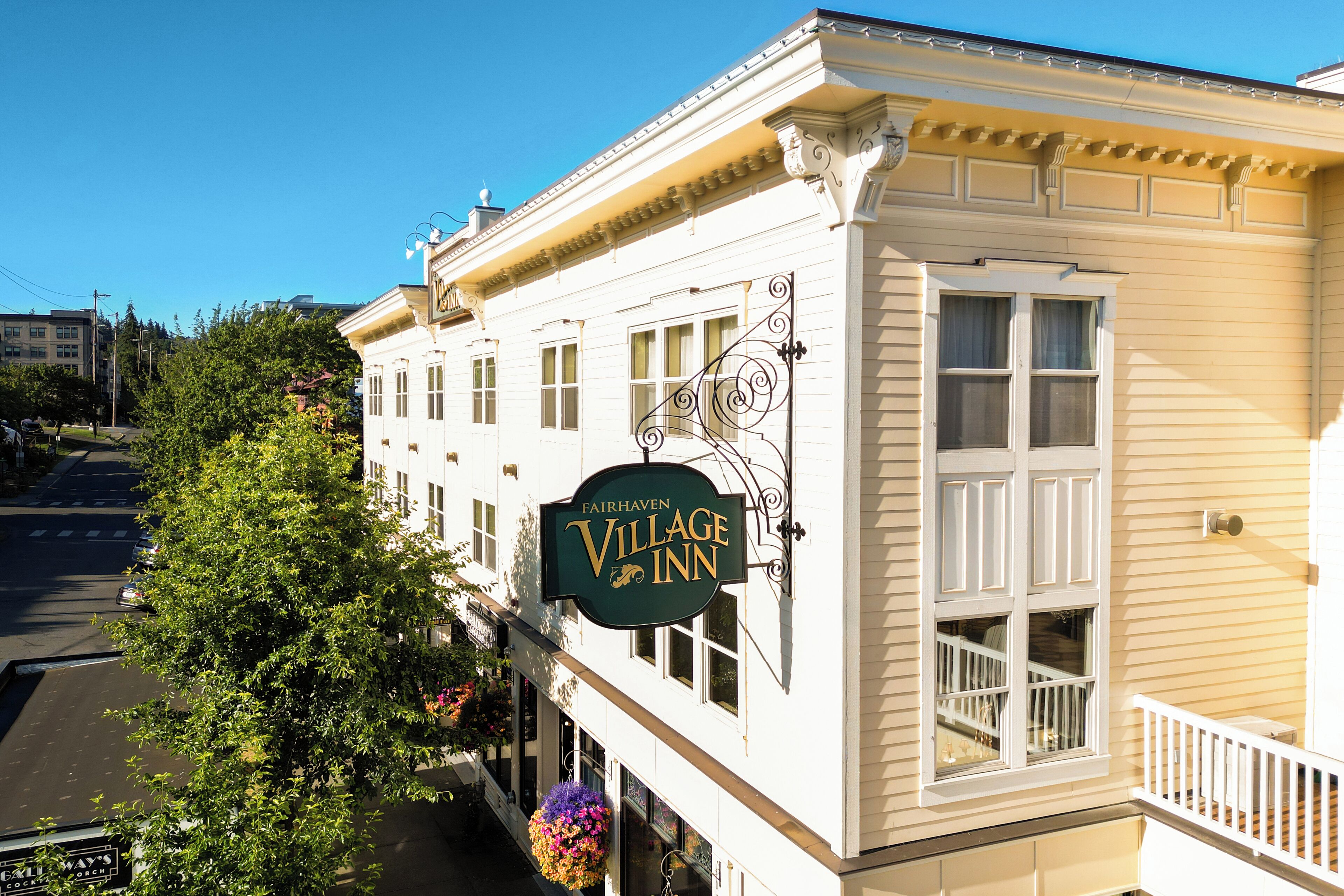 A building with a sign reading "Fairhaven Village Inn."