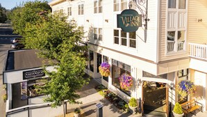 A two-story building with a sign for 'Fairhaven Village Inn' and a smaller sign for 'Calleway's Cocktail Porch'. - Fairhaven Village Inn (Bellingham)