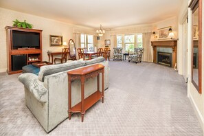 Premium bedding, desk, laptop workspace, blackout drapes